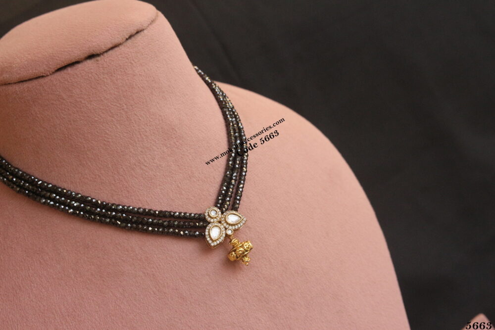 CZ pendant with real cz black beads and antique ball