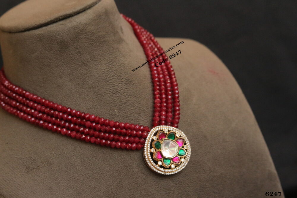 Navrathan pendant with ruby beads