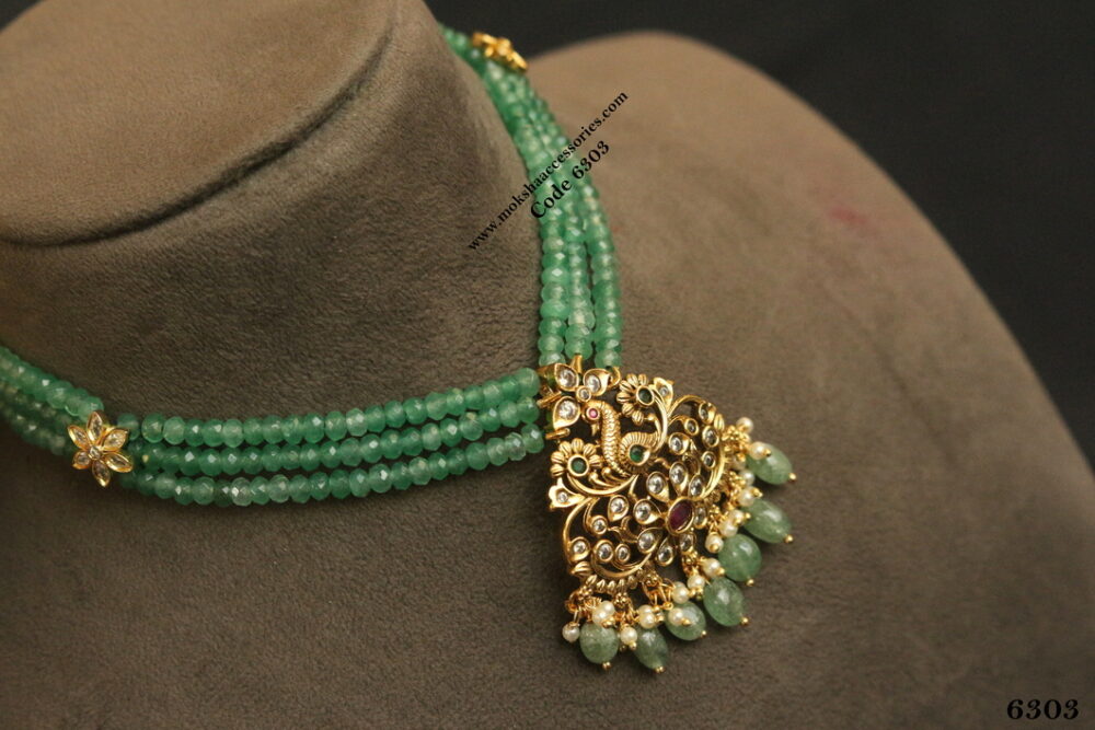 Antique pendant with emerald beads and cz flower pendant