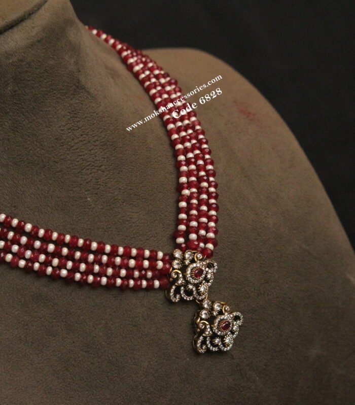 Antique gold pendant with ruby and pearl necklace