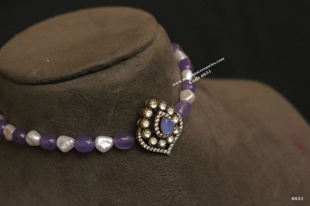 Antique gold pendant with pearl and lavender beads