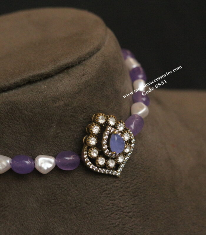 Antique gold pendant with pearl and lavender beads
