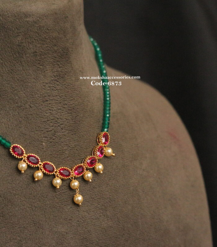 Ruby pendant with real emerald beads