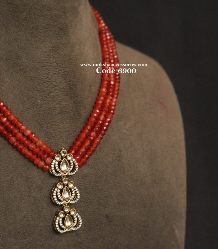 Kundan pendant with orange beads