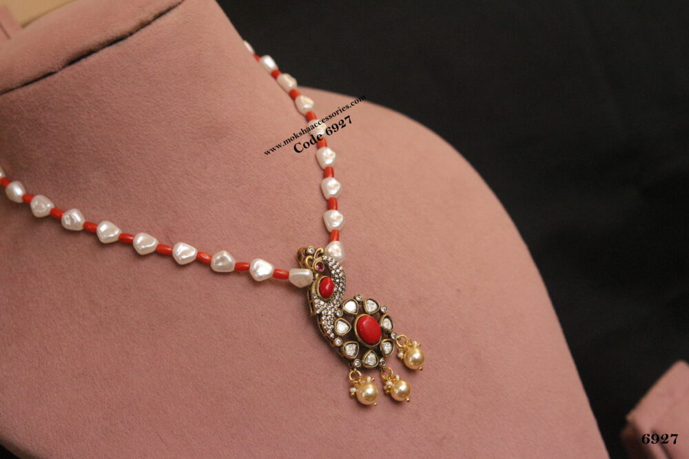 Coral peacock pendant with coral and pearl chain