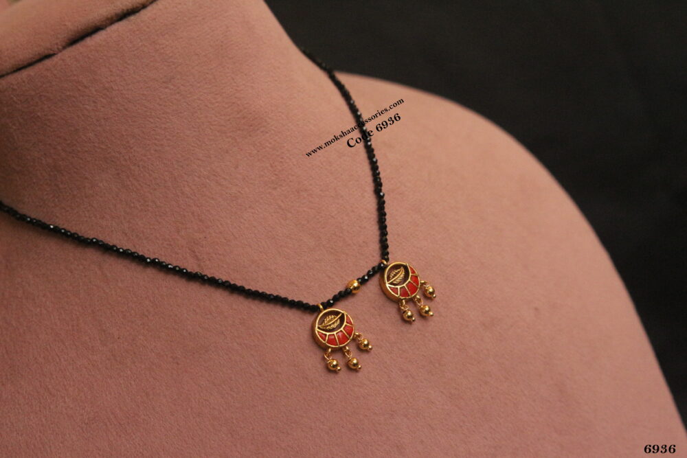 Black beads with coral pendants