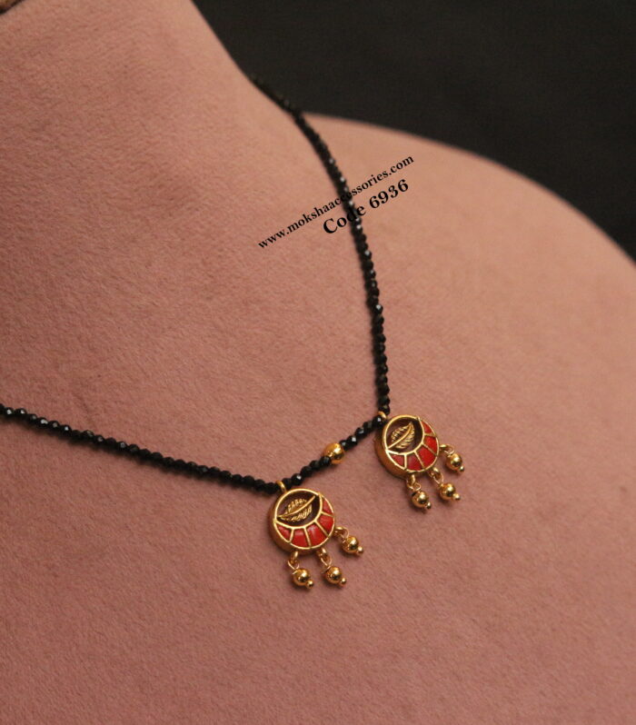 Black beads with coral pendants