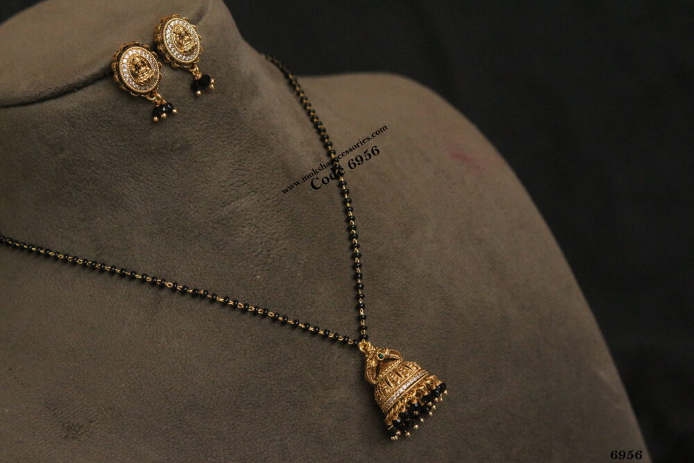 Gold jhumki pendant with laskhmi devi studs