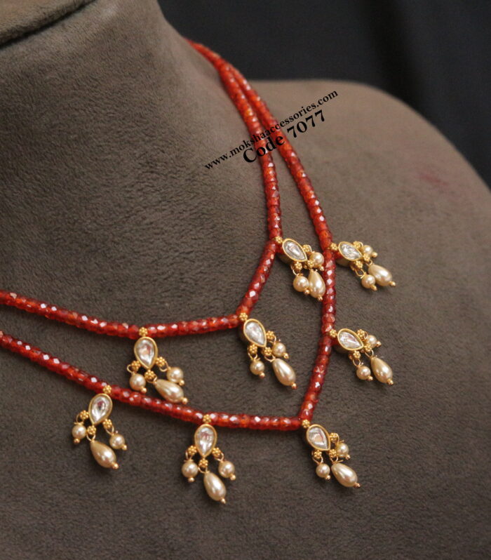 Real cz coral beads with jadaukundan pendants and sarvoski pearl drops