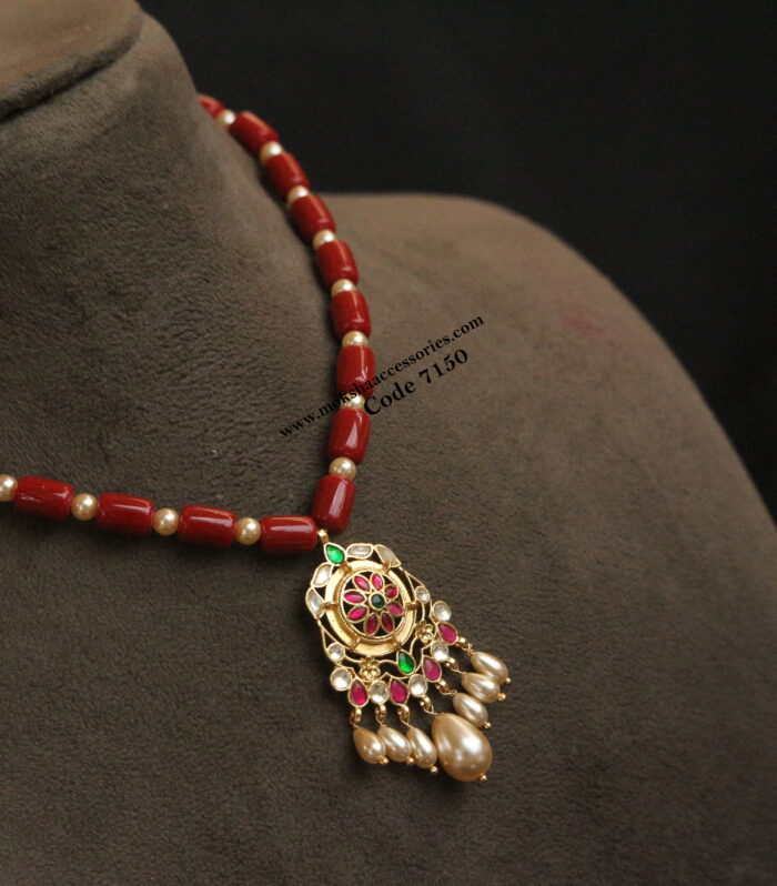 Gold jadaukundan pendant with coral and sarvoski pearl