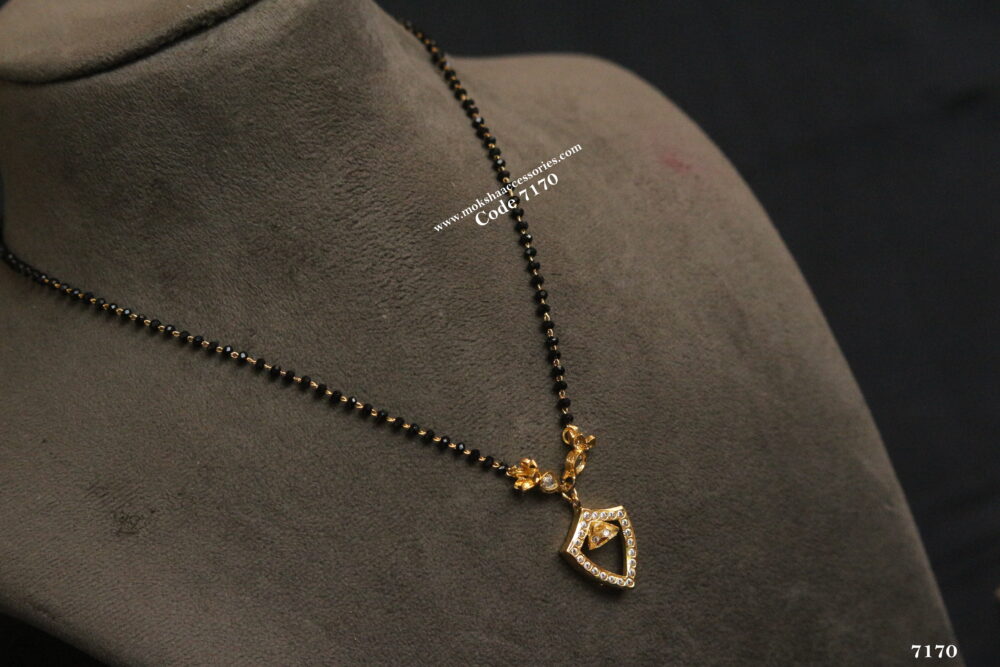 Black beads with gold pendant