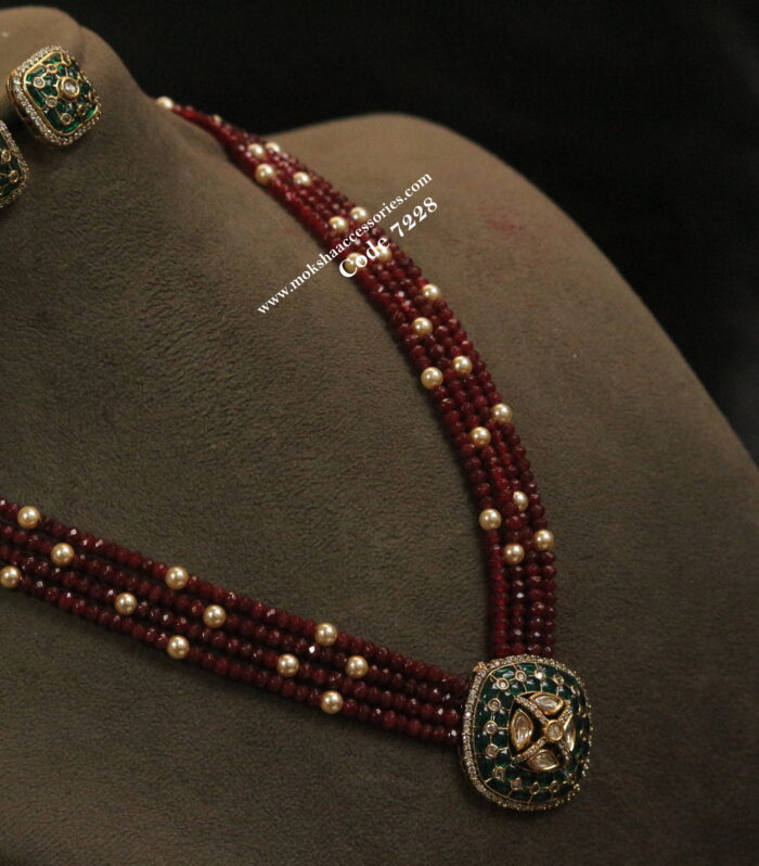Kundan pendant set with ruby and sarvoski pearl mala