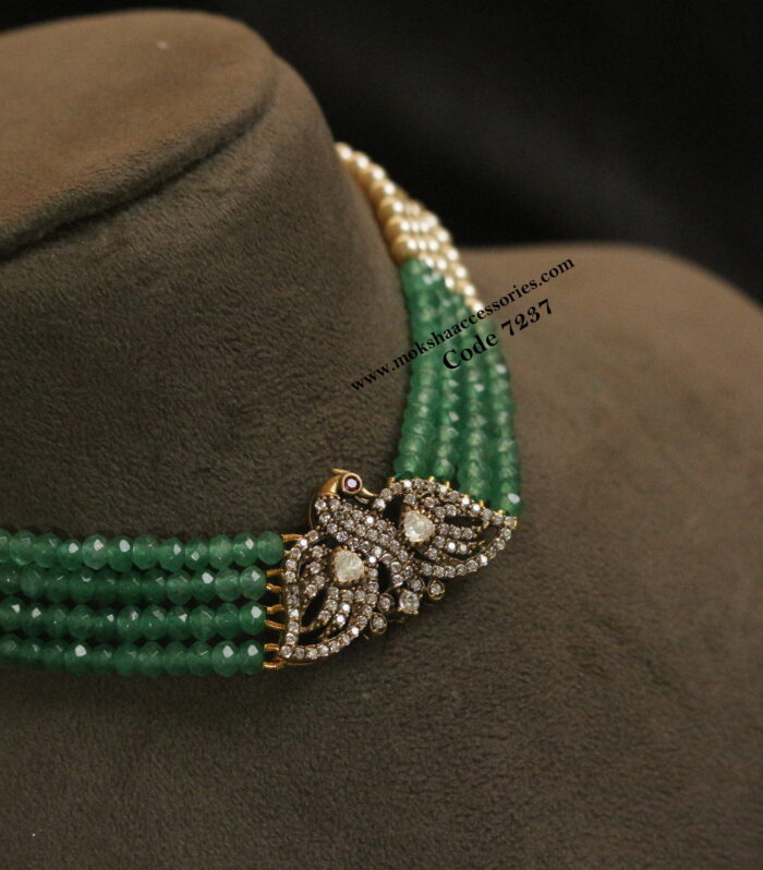 CZ pendant with emerald and sarvoski pearls