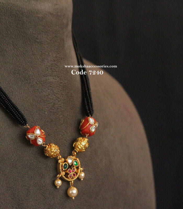 Black beads with jadaukundan pendant and real coral beads