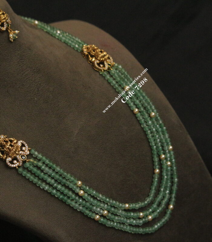 Lakshmi devi gold pendant set with emerald and sarvoski pearl mala