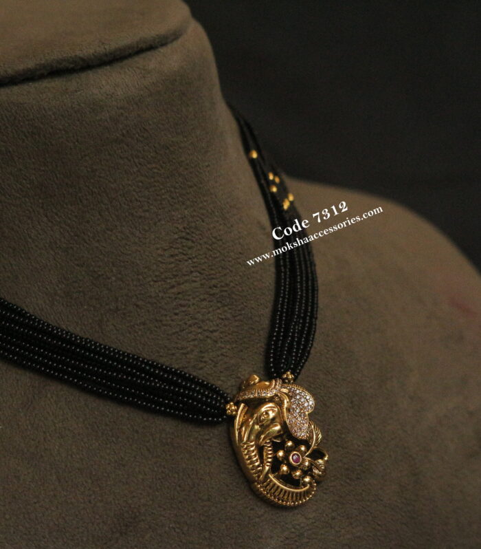 Ganesh antique gold pendant with black beads and gold balls