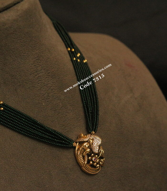Ganesh antique gold pendant with green beads and gold balls