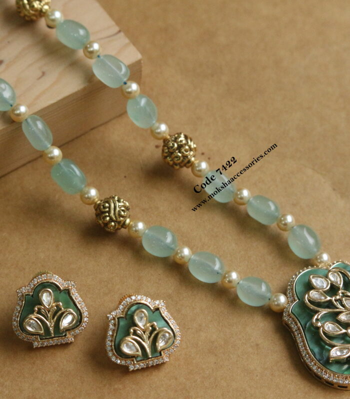 Kundan pendant with onyx beads and antique gold balls mala