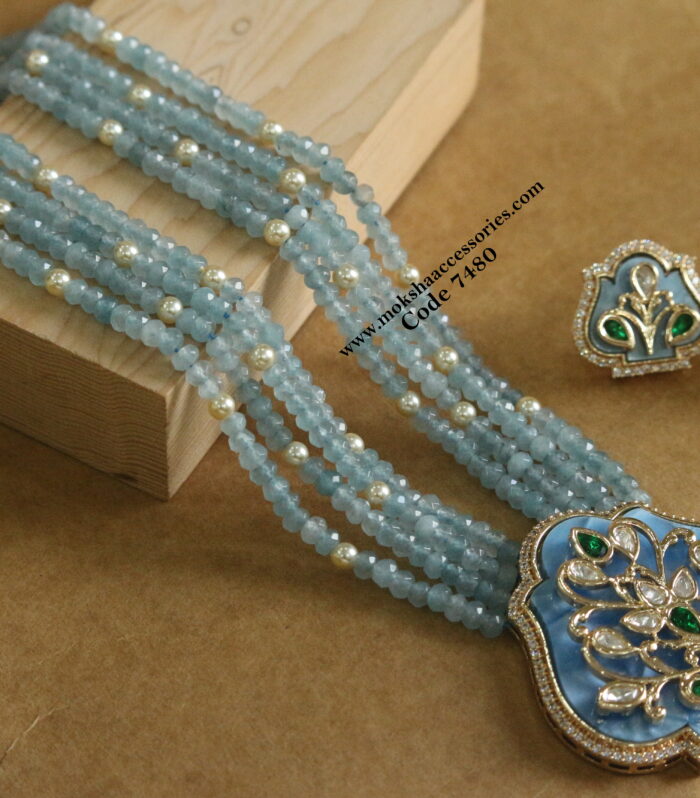 Kundan pendant set with blue beads and sarvoski pearls