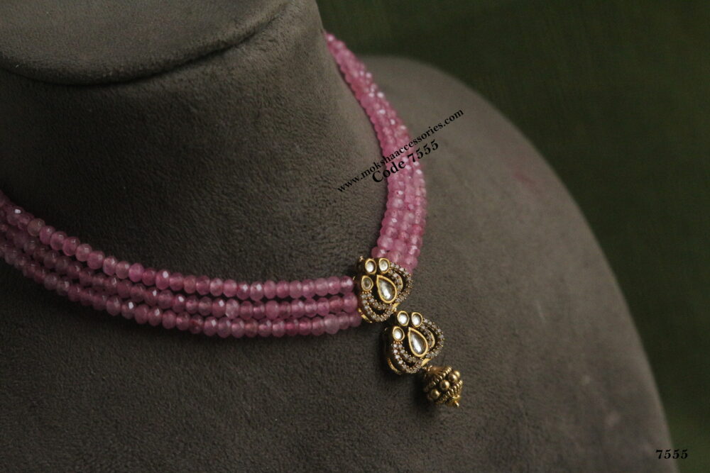 Kundan pendant with pink beads and gold ball