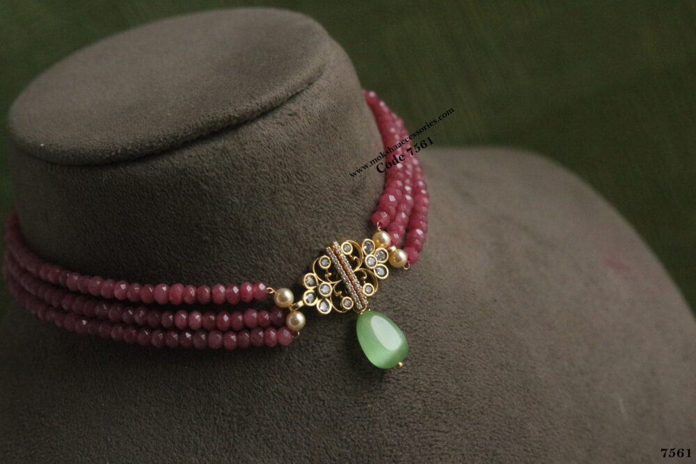 Antique gold pendant with pink beads