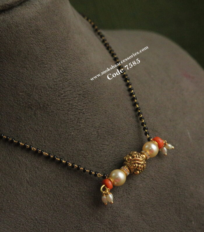 Black beads with antique gold ball