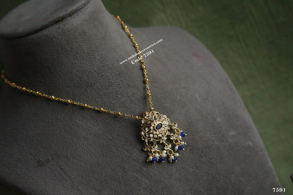 Gold chain with antique gold blue stone pendant