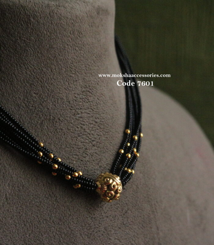 Antique gold balls with black beads