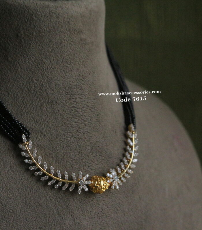 CZ pendant with gold balls and black beads