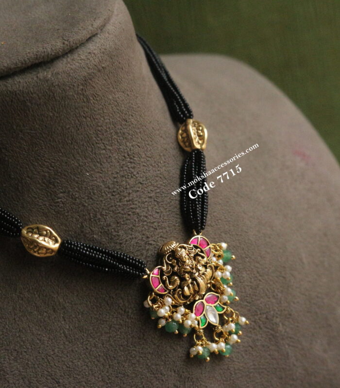 Lakshmi Pendant with black beads and antique gold balls