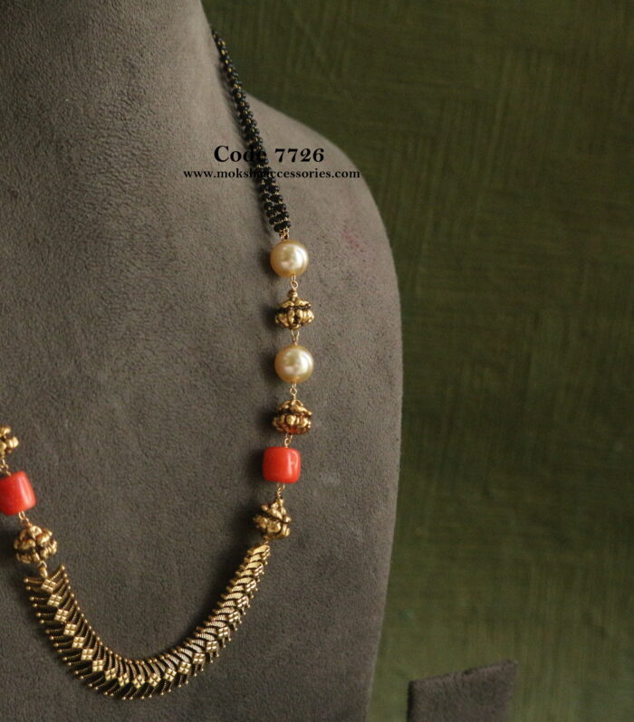 Black beads with antique balls and corals