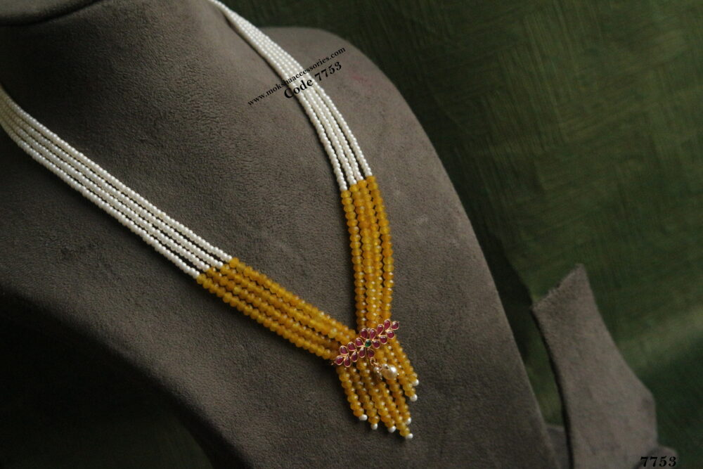 Ruby pendant with yellow beads and pearl mala