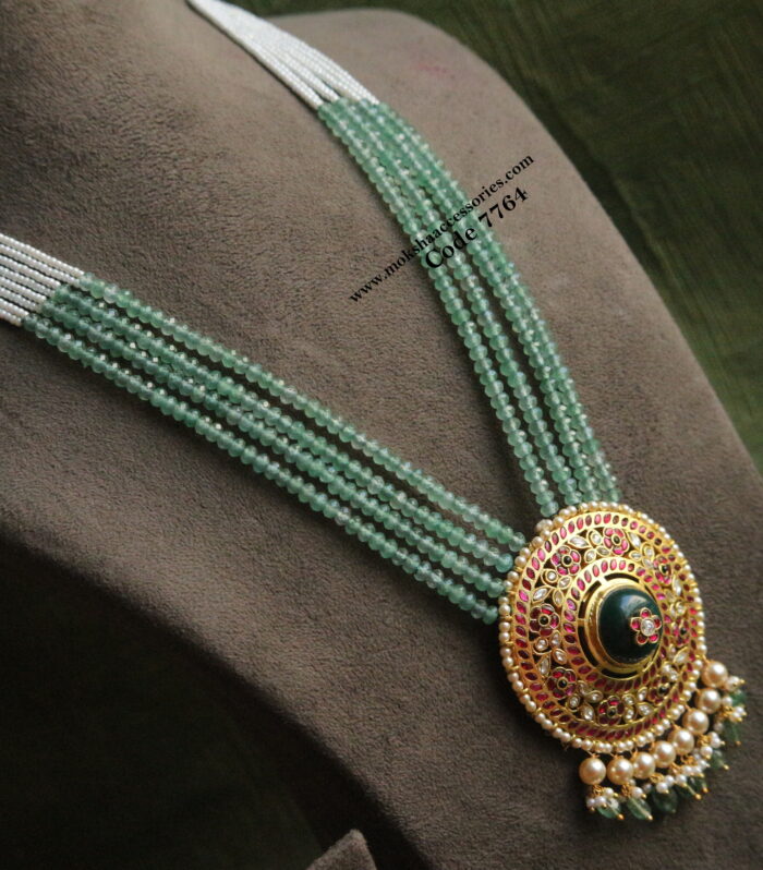 Jadaukundan pendant with emerald beads and pearl chain