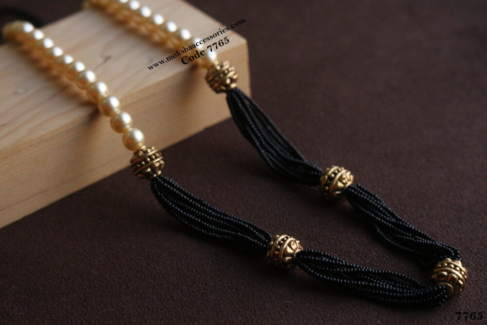 Black beads with antique gold balls and sarvoski pearl