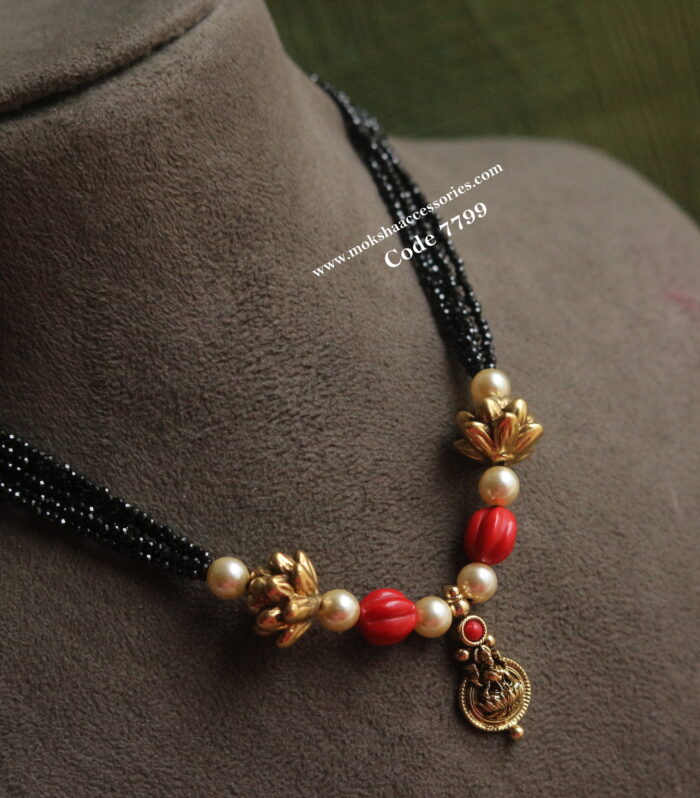 Kasu pendant with coral and black beads