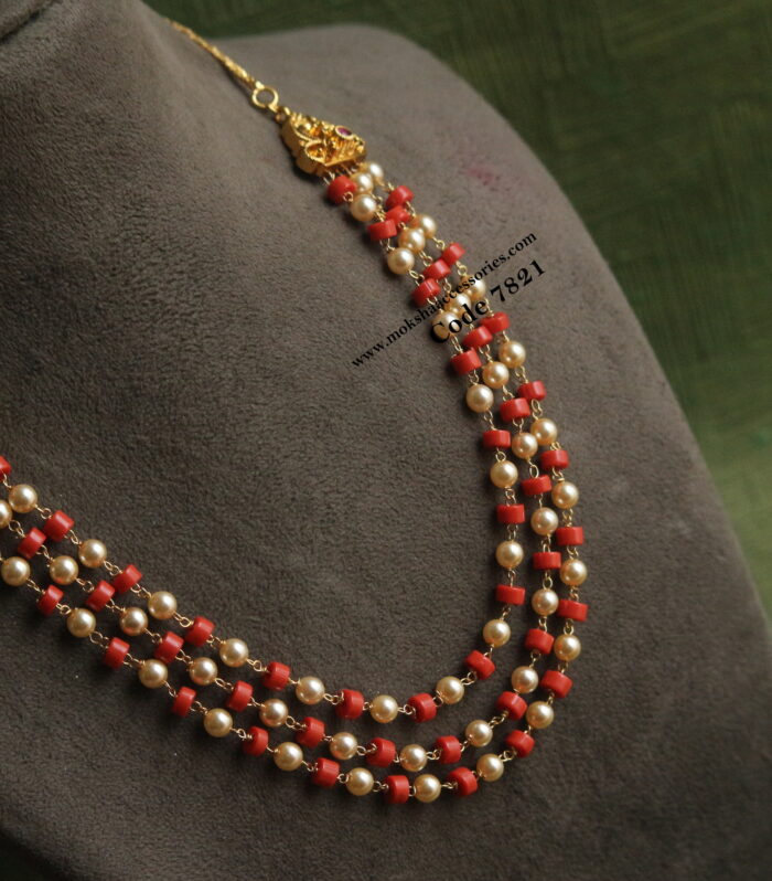 Coral and sarvoski pearl mala