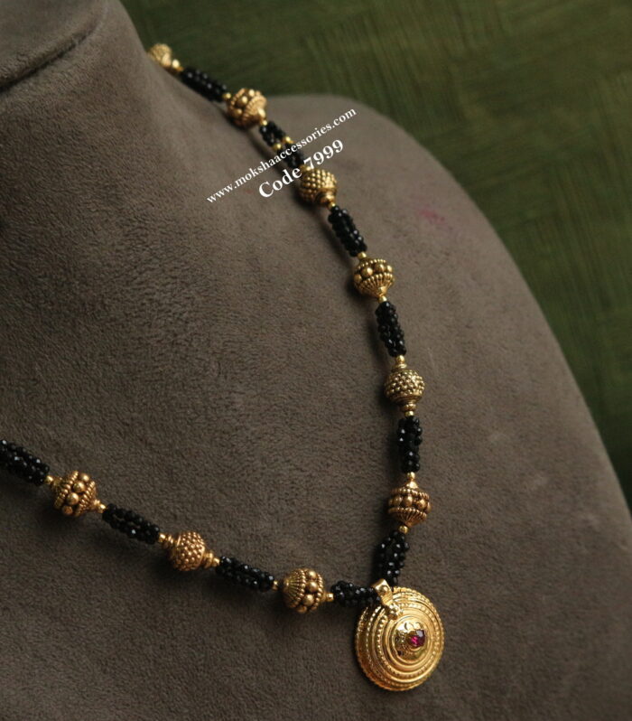 Kasu pendant with black beads and antique gold balls mala