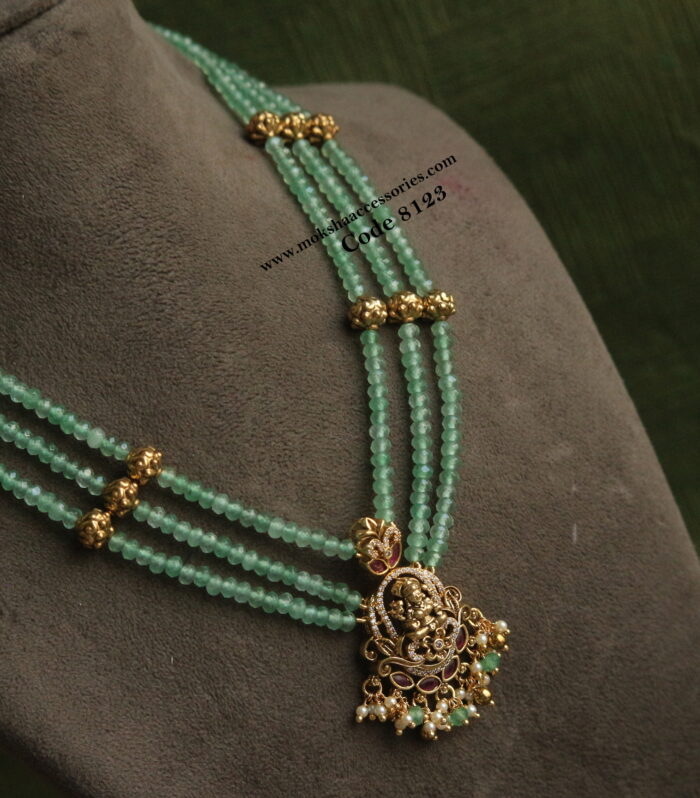 Lakshmi devi pendant with emerald beads and antique gold balls