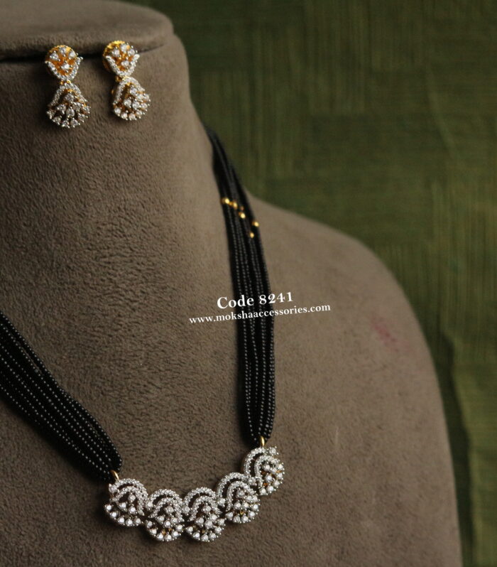 CZ diamond alike pendant set with black beads and gol balls