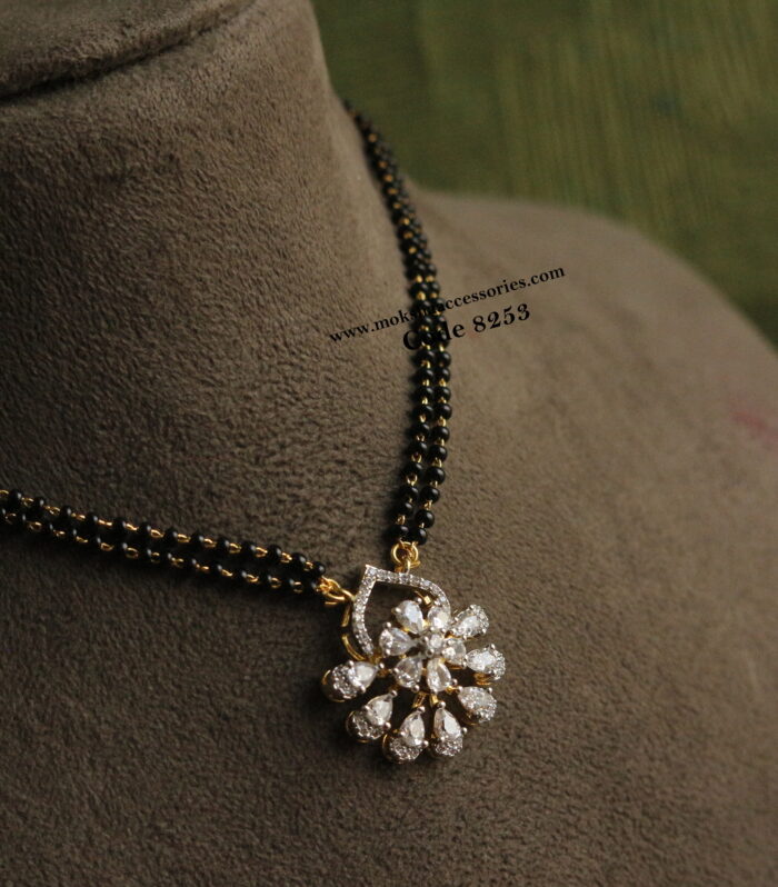 Diamond alike pendant with black beads