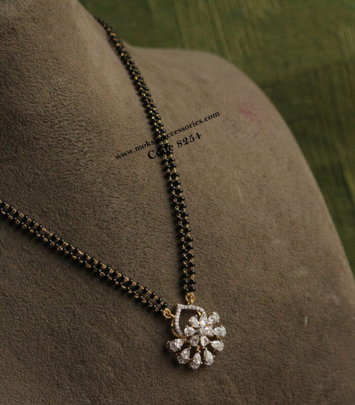 Diamond alike pendant with black beads