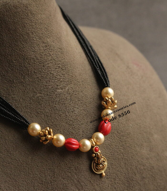 Kasu pendant with coral, antique gold balls and black beads