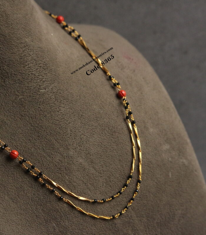 Gold chain with black beads and pumpkin corals