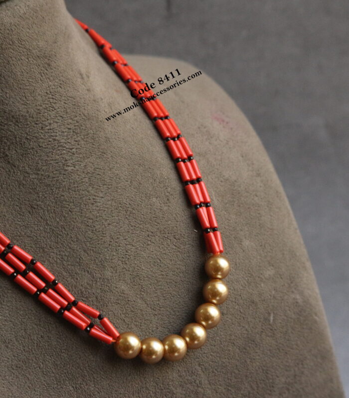Coral with black beads and sarvoski pearl