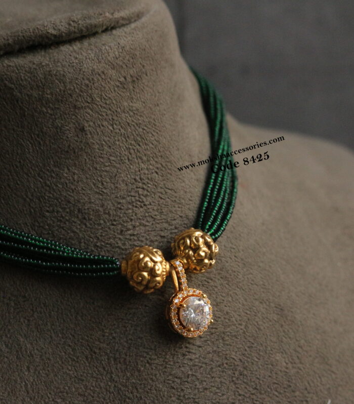 Diamond alike pendant with green beads and antique gold balls