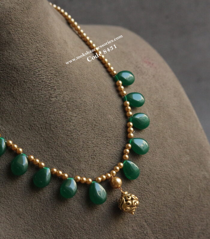 Green drop beads with sarvoski pearl and antique gold drop