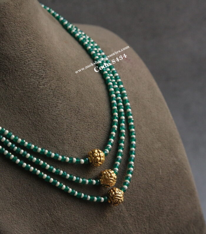 Emerald and pearl mala with antique gold balls