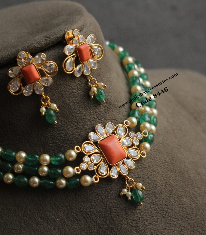 Coral cz pendant set with emerald and sarvoski pearl