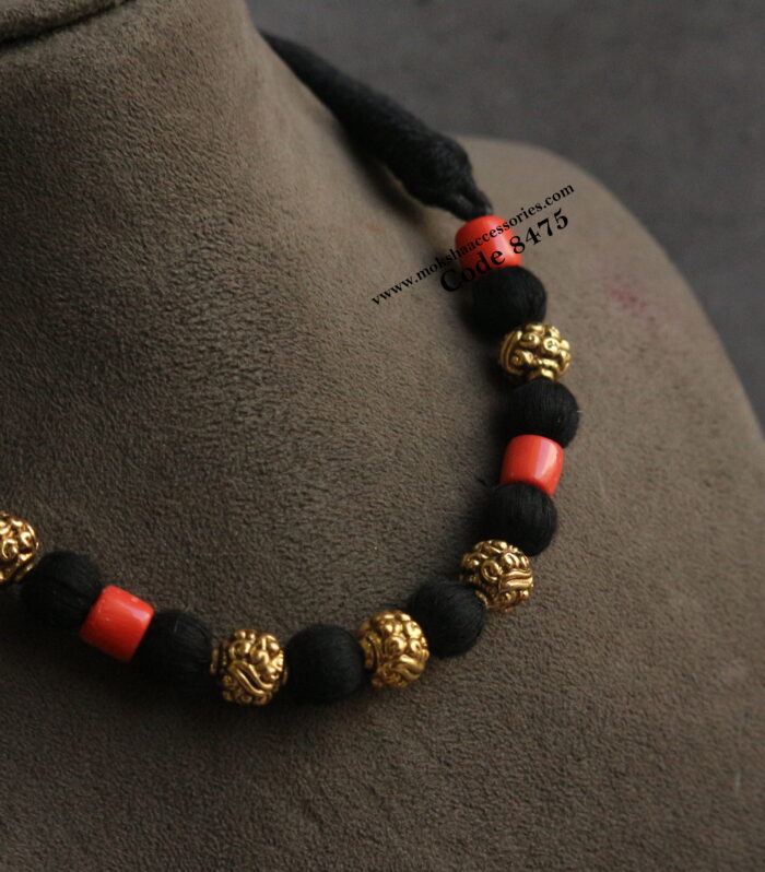 Black thread neckpiece with coral and antique gold balls