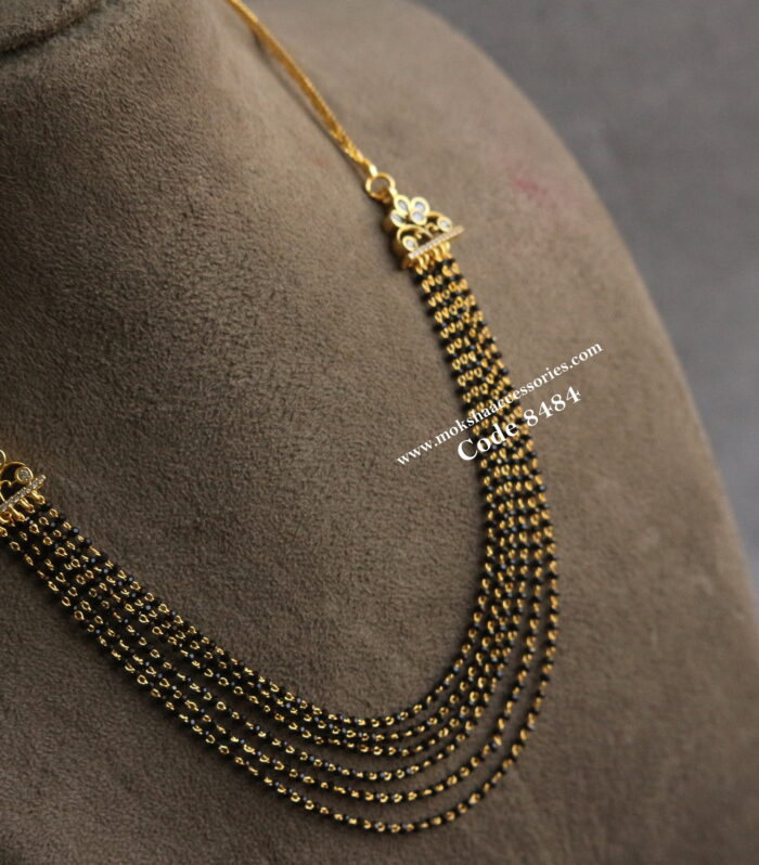 Black beads with gold pendants and back gold chain